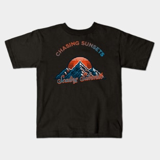 Chasing sunsets, Scaling summits Kids T-Shirt